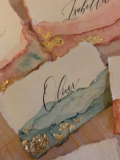 three pieces of paper with gold foil on them