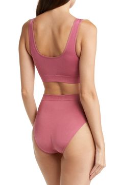 Smooth and stretchy fabric shapes a soft bralette designed with seamless construction for all-day comfort and a wide underbust band that provides light support for smaller figures. Knitting between the cups creates natural shaping and definition. Removable soft cups Partially lined Nylon/spandex Hand wash, line dry Imported Women's Clothing