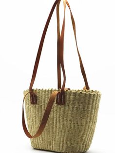 Casual style. Lightweight. Straw. Raffia natural fiber. Measurements are 40 cms. Length (15.74” inches) x 24cms height (9.4” inches). Color may be lighter or darker depending of the device it is displayed. Brown Jute Bucket Bag In Basket Shape, Brown Jute Basket Bucket Bag, Brown Straw Bag With Adjustable Strap For Market, Handwoven Top Handle Straw Bag For Travel, Brown Jute Basket-shaped Bucket Bag, Chic Straw Bag For Market, Brown Rectangular Bucket Bag In Natural Fiber, Natural Straw Shoulder Bag For Market, Brown Handwoven Top Handle Straw Bag