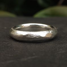 a silver ring sitting on top of a table