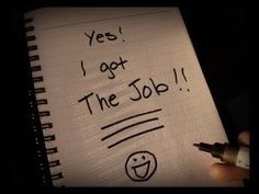 someone writing on a notepad that says yes i got the job