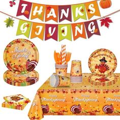 a thanksgiving themed table setting with turkey plates, napkins and candy bar wrappers