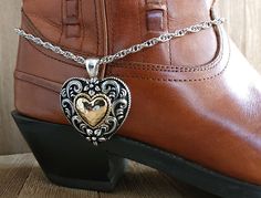 Silver and gold filigree cowboy boot bracelet, boot bling antique silver and gold heart pendant.  Large silver tone wheat chain with a large antique silver heart pendant.  This gorgeous pendant has floral details and scroll-work in antique silver with a gold hammered metal heart center.  The specialty wheat chain closes with a sturdy lobster claw clasp and is adjustable to fit most boots.  (This listing is for a single bracelet).   Ready to ship.  Thank you for stopping by!  Each item ships beau Western Metal Jewelry Nickel Free, Nickel-free Western Metal Jewelry, Nickel-free Metal Western Jewelry, Western Metal Jewelry For Western-themed Events, Western Engraved Jewelry For Rodeo, Western Style Engraved Jewelry For Rodeo, Vintage Silver Jewelry For Rodeo, Vintage Gold Jewelry For Rodeo, Handmade Western Style Gold Jewelry