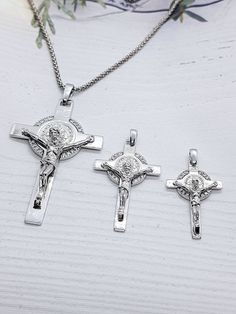 This Spiritual Crucifix of Saint Benedict Double Sided made from high quality sterling silver 925 its the perfect gift for anyone and excellent for everyday wear. Cubic Zirconia Crucifix size :5.5cm×3cm(with a hook) Crucifix size :3.5cm×2cm (with a hook) Crucifix size :3cm×1.80cm (with a hook) Chain length : 45cm or 40 cm White Gold Sterling Silver Crucifix, Sterling Silver Crucifix Jewelry As Gift, Personalized Silver Crucifix Jewelry, Silver Cross Pendant With Sterling Silver Clasp, Nickel-free Sterling Silver Crucifix Necklace, Silver Sterling Silver Crucifix Necklace, Nickel-free Sterling Silver Crucifix Jewelry, Silver 925 Stamped Crucifix Jewelry, Nickel Free Silver Crucifix Necklace