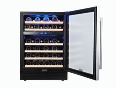 an open wine cooler with many bottles in it's door and lights on the side