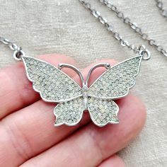 Cute vintage clear rhinestone pave butterfly silvertone pendant necklace. The butterfly has its wings open and the rhinestones are clear with some of them showing color change from age. To me the color variation adds character and gives the necklace a charming vintage vibe. It has nice shine and subtle sparkle. I love the older jewelry it has personally. the necklace is approximately 17" and the butterfly is 1" tall and 2" wide. Butterfly Pendant Necklace, Old Jewelry, Vintage Vibe, Butterfly Pendant, The Butterfly, Vintage Vibes, Clear Rhinestones, Last Minute Gifts, Color Change