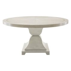 an oval dining table with two pedestals on each side and a circular top in white marble