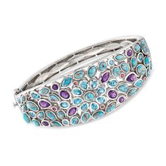 Ross-Simons - 4.80ct t. w. Multi-Gemstone, Turquoise Bangle Bracelet. 8". This cool-toned bangle bracelet will add an artistic flair to your favorite outfits. An eye-catching palette of multi-shaped turquoise cabochons, Swiss blue topaz, amethysts and rhodolite garnets, totaling 4.80 carats, is set in sterling silver. Hinged. Push-button clasp, multi-gemstone and turquoise bangle bracelet. Blue Topaz birthstones are the perfect gift for December birthdays. Blue Multi-stone Bangle, Blue Multi-stone Bangle Jewelry, Elegant Turquoise Multi-stone Bracelets, Fine Jewelry Turquoise Gemstone Bracelet, Turquoise Bangle, Topaz Birthstone, Bracelet In Silver, Stone Bangle, Bracelet Blue