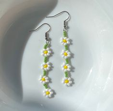 Set of 4 white daisies per earring, made out of nylon thread and seed beads, attached to an earring hook.  Handmade by me :) please handle with care <3 Beaded Dangle Earrings, Etsy Earrings Dangle, Beaded Dangles, Seed Beads, Seeds, Daisy, Jewelry Earrings Dangle, Dangle Drop Earrings, Dangle Earrings