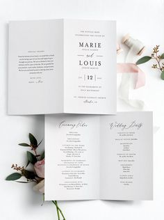 wedding program booklets with pink flowers and greenery on the bottom right corner, folded in white paper