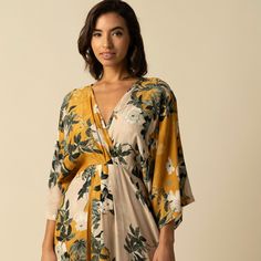 Embrace vibrant elegance with the Sophia Yellow Dress, featuring a beautiful floral print and a sophisticated wrap design. This dress showcases a flattering V-neckline and a flowy high-low hem, perfect for any occasion. Crafted from lightweight, breathable fabric, it ensures comfort and style throughout the day. Whether for casual outings or formal events, the Sophia Yellow Dress adds a touch of chic to your wardrobe. Dress Material is Viscose Crepe 100% Polyester  Dry Clean only by a specialist dry cleaner unless otherwise instructed on the care label. Steam iron for best results. Statement Outfit, June Birthstone Jewelry, Dresses Xxl, Dry Cleaners, Steam Iron, Pearl Jewellery Earrings, Jewelry Ring Box, Size 8 Dress, June Birth Stone