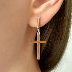 Cross earrings 925 sterling silver mono earrings are exquisite and stylish jewelry that are ideal for creating an elegant look. Made from 925 sterling silver, they are high quality and durable. The combination of stylish design with the sparkle of silver adds flair and appeal to these earrings. Crosses and crosses on silver earrings are a current fashion trend. They add sophistication and style to your look. Thanks to their versatility, these earrings can be easily combined with any outfit, highlighting your personality and charisma. They are ideal for both everyday use and special occasions. The earrings have an elegant and compact design. They are lightweight and comfortable to wear. The clasp is made of 925 sterling silver and provides a secure fit. This allows you to wear your earrings Minimalist Shiny Finish Earrings For Gift, Minimalist Metal Earrings With Shiny Finish, Silver Earrings With Shiny Finish For Gift, Modern Shiny Finish Earrings For Gift, Minimalist White Gold Earrings With Shiny Finish, White Gold Earrings With Shiny Finish For Gift, Sterling Silver Earrings With Shiny Finish As Gift, Shiny Finish Earrings Perfect As A Gift, Shiny Finish Earrings For Gift