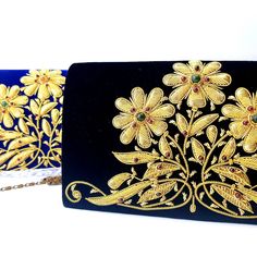 "Luxury black velvet evening clutch bag, expertly hand embroidered with gold flowers and embellished with genuine semi precious stones, to create an opulent, sophisticated 3D effect. Add an eye-catching pop of color, texture and sparkly bling to your overall party look. It is just the right size to hold your essentials for the night - phone, credit cards, money, keys and lipstick. The shoulder strap keeps your hands free for carrying a drink or holding a plate of food. Or twist the shoulder stra Elegant Hand Embellished Black Bag, Elegant Black Hand-embellished Clutch, Elegant Black Hand-embellished Bag, Elegant Black Hand Embellished Clutch, Formal Hand Embellished Bags For Festivals, Luxury Gold Evening Bag With Handwork, Traditional Black Clutch For Evening Events, Traditional Black Clutch For Evening, Traditional Black Evening Clutch