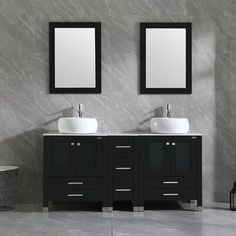 two sinks and mirrors in a bathroom with grey walls, black cabinets and white counter tops