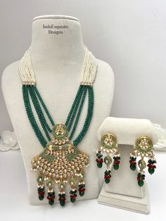 Kundan Meenakari Raani Haar( Long pearl Necklace) comes with Earrings/Bridal long necklace set/Green maroon long necklace  Bridal /Indian Wedding jewelry/bridal jewelry/ Indian jewelry /Kundan Jewelry/pearl necklace/ Punjabi necklace/ Pakistani jewelry/High quality Indian Jewelry We kindly request to consider minor variations in colors, shades, textures as pictures displayed may slightly vary from the actual product due to digital image limitations. Please expect the possibility of some minor imperfections when buying handmade jewelry. Please contact us for any questions you might have. We will keep bringing the best quality jewelry for you. Thank you and happy shopping !! 😊 Green Kundan Chandbali Necklace With Meenakari, Green Chandbali Kundan Necklace With Meenakari, Green Meenakari Chandbali Kundan Necklace, Green Chandbali Kundan Necklace In Temple Jewelry Style, Green Kundan Necklace With Cutdana In Temple Jewelry Style, Festive Green Kundan Necklace With Meenakari, Festive Green Kundan Temple Jewelry Necklace, Festive Green Kundan Necklace For Celebration, Festive Green Kundan Temple Necklace