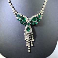 Necklace Rhinestones Green Clear Stunning Vintage In excellent condition. Fantastic necklace perfect for dress up, holidays, etc. Brilliant green and clear rhinestones are on a silver tone setting. Spectacular! Measures approximately 16.5 inches long. Clasp mechanism is in good working order. NECK0024 Sparkling Green Crystal Jewelry, Green Crystal Necklaces With Sparkling Stones, Green Rhinestone Necklaces For Formal Occasions, Green Crystal Jewelry With Rhinestones, Elegant Green Rhinestone Necklace With Sparkling Stones, Formal Green Rhinestone Necklaces, Formal Green Rhinestone Jewelry, Costume Jewelry Crystal Necklace With Rhinestones, Green Crystal Rhinestone Necklace For Wedding