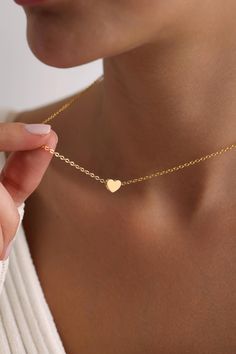 Welcome to the magical world of PKJewelry Love Pendant Necklace Minimalist Heart Necklace is perfect as a special gift for her. This Mini Love Necklace is a great choice as a gift for Mother's Day, Birthday, Anniversary, Valentine's Day, Christmas. High quality heart necklace is specially prepared for you with great care. The gold plating on it is much thicker than other platings. Therefore, it is a nice gift to be used for a long time. Our products do not tarnish and are anti-allergic. - Our chains are sent with 16 inch and 2 inch extension chain. You can adjust it to the size you want. If you want it shorter or longer, please contact us.   All Our Heart Locket Necklace  https://www.etsy.com/shop/PKJewelryNecklace?ref=shop-header-name&listing_id=1794870106&from_page=listing&search_query=h Small Heart Necklace, Tiny Heart Necklace, Mini Love, Special Gifts For Her, Heart Locket Necklace, Necklace Heart, Necklace Minimalist, Tiny Heart, Wedding Jewellery Necklace