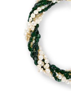 With four intertwined, beaded strands, this emerald green stone and pearl Kenneth Jay Lane necklace will be just the right addition to your look. It's finished with a decorative D-clasp closure and is designed to rest perfectly against your chest. Wear it to elevate simple necklines on dresses and knits alike. Green Pearl Necklace For Formal Occasions, Elegant Green Double Strand Jewelry, Formal Green Pearl Necklace, Elegant Green Round Beaded Necklaces, Elegant Green Round Beaded Necklace, Elegant Green Single Strand Pearl Necklace, Elegant Multi-strand Beaded Necklaces With Gemstones, Elegant Multi-strand Gemstone Beaded Necklace, Formal Green Pearl Necklace With Round Beads