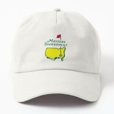 a white hat with the words masters tournament written on it and a yellow golf ball