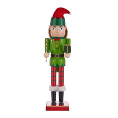 a green and red nutcracker figure with a santa hat on it's head