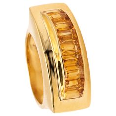 Art-Deco geometric tank ring. A retro machine age piece, made during the art deco period, circa 1940. This unique cocktail Tank ring has been crafted in solid yellow gold of 18 karats, with high polished finish. Bezel set at top inside a channel, with 9 emeralds corner cuts (5 x 3 x 3 mm) of natural orange citrines with a combined weight of 4.5 carats. The gemstones are caliber cuts with great vivid color saturation and transparent with no inclusions. Have a total weight of 13.4 grams and the ac Tank Ring, Art Deco Geometric, Unique Cocktails, Machine Age, Art Deco Period, Vivid Color, Solid Yellow, Cocktail Rings, Solid Gold