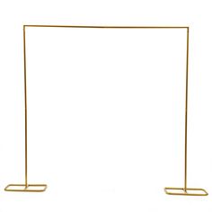 two gold metal stands with one standing on the other