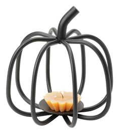 a small pumpkin shaped candle holder on a white background