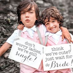 two children holding signs that say, don't worry ladies, we're cute just wait for the bride