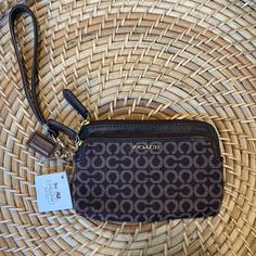 Nwt Coach Wristlet Brown Leather With Two Zippered Pockets Brown Clutch Wallet With Detachable Strap, Coach Pouch Wristlet For Travel, Brown Pouch Wristlet For On-the-go, Coach Wristlet With Zipper Pouch For Travel, Coach Wristlet With Wrist Strap For Travel, Brown Clutch Wristlet For Everyday Use, Brown Clutch Wristlet, Brown Everyday Clutch Wristlet, Coach Travel Wristlet Clutch