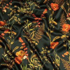 an orange and yellow floral print on black fabric