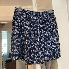 Brand New Jack Wills Blue Floral Flowy Skirt & Button Down Top Casual Blue Skirted Shorts, Casual Short Floral Print Skirt, Blue Mini Skirt For Vacation, Blue Short Skirt For Vacation, Casual Blue Flowy Skort, Short Blue Skirt With Elastic Waistband, Blue Flowy Short Skort, Blue Flowy Lined Wrap Skirt, Blue Short Flowy Skirt