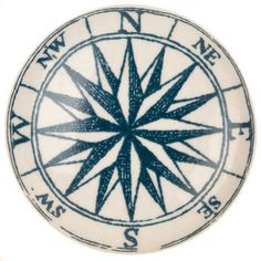 a white and blue compass with words on it