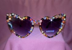 Indulge in glam with our heart shaped blinged-out sunglasses, exuding elegance with dazzling  rhinestones. Yeri Mua, Space Cowgirl, Shaped Sunglasses, Heart Shaped Sunglasses, Adult Crafts, Denver Co, Eyewear Sunglasses, Ultra Violet, Sunglasses Accessories