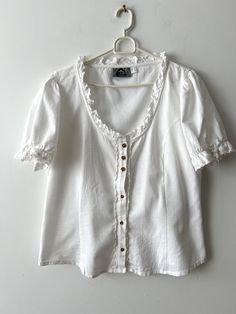 Vintage Extra large Austrian Shirt Women's Short puff sleeve Dirndl blouse Summer Folk Traditional Bavarian Shirt Trachten Blouse  Label size: D/NL 44; GB 18; F 46; I 50 Estimated size: XL Measurements: (lying flat) Length - 23"/ 58.5 cm Shoulders: 16'/ 40.5 cm pt to pit: 22"/ 56 cm Waist: 20"/ 50.7 cm Sleeve: 10.5"/ 26.5 cm Collar: 15"/ 38 cm Please check measurements to insure a proper fit. Remember to allow yourself some extra room for movement. You can compare these with something from your French Blouse, Dirndl Blouse, Blouse Summer, Short Puff Sleeve, Vintage Blouse, Extra Room, Blouse Vintage, White Blouse, Mom Style