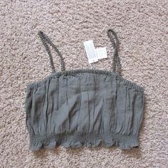 Nwt American Eagle Medium Olive Green (Little Brighter Than Photo Appears) Crop Top Spaghetti Straps Elastic Bottom/Top & Straps Viscose Poly Blend Laying Flat Across Top: 17", Will Stretch Top To Bottom: 9.5" Smoke Free Home Good Quality Green Casual Crop Top With Adjustable Straps, Casual Green Crop Top With Adjustable Straps, Casual Crop Top With Straps, Casual Strapped Crop Top, Casual Green Tops With Straps, Casual Spring Crop Top With Straps, Casual Cotton Crop Top With Spaghetti Straps, Casual Cotton Crop Top With Adjustable Straps, Olive Green Crop Top