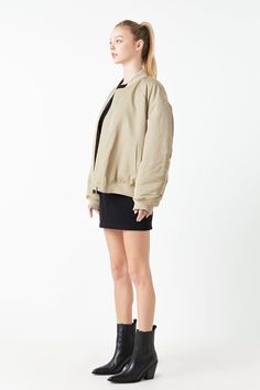 Unlock your streetwear style with this Ruched Bomber Jacket. Featuring a classic bomber silhouette with long sleeves front zipper closure and ruched detailing at the back. This unique jacket will update any look making it perfect for any occasion. The ruched detailing gives it an extra edge that sets it apart from other bomber jackets. Stay stylish and explore the possibilities with this Ruched Bomber Jacket that is sure to become a wardrobe staple. Bomber Ruched at back Long sleeves Front zipper closure Rib Lined Hand Wash Cold Do Not Bleach Do Not Tumble Dry Iron Low Shell: 100% PolyesterLining: 100% PolyesterContrast: 95% Cotton 5% Spandex AY154J Total length: 26" Bust: 52" Fall Long Sleeve Track Jacket With Elastic Cuffs, Long Sleeve Cropped Jacket With Zipper For Streetwear, Cropped Long Sleeve Jacket With Zipper For Streetwear, Casual Cropped Jacket With Zipper For Streetwear, Oversized Cropped Jacket For Fall Streetwear, Fall Outerwear With Elastic Cuffs And Relaxed Fit, Oversized Long Sleeve Cropped Jacket For Streetwear, Casual Cropped Long Sleeve Jacket With Ribbed Cuffs, Relaxed Fit Winter Outerwear With Zip Cuffs