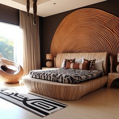 a large bed sitting on top of a wooden floor next to a window in a bedroom