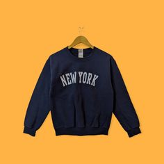 New York city spell out sweatshirt New York city crewneck New York sweater pullover streetwear sports style dark blue colour size small by YoungmodernCo on Etsy Navy Long Sleeve Sweater For Streetwear, Urban Crew Neck Sweater With Letter Print, Blue Varsity Sweater For Streetwear, Navy Crew Neck Sweatshirt For Streetwear, Navy Sweatshirt For Winter Streetwear, Navy Letter Print Sweater For Winter, Navy Relaxed Fit Sweatshirt For Streetwear, Urban Sweatshirt With Lettering, Long Sleeve, Varsity Sweater With Letter Print For Streetwear