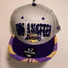 a los angeles lakers hat hanging on the wall