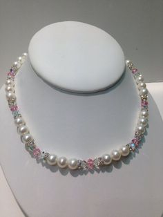 "Original Design, Genuine 8.5mm Pearl and Swarovski Crystal Necklace, 17\" long, Hand Strung with metal string, magnetic closure. Pearl is the June birthstone. Perfect for bridesmaids gifts, or for a bride to wear. Ask for colors to match your theme or bridesmaid dresses. Made to order in any length or color Available. Matching Bracelet Available." Crystal Necklace With Spacer Beads For Gift, Crystal Necklaces With Round Beads For Anniversary, Crystal Necklaces With Spacer Beads For Gifts, White Necklaces With Sparkling Stones For Jewelry Making, Anniversary Crystal Necklaces With Round Beads, Anniversary Necklace With Crystal Round Beads, White Single Strand Crystal Jewelry, White Crystal Jewelry With Spacer Beads, Gift Necklace With Sparkling Round Beads