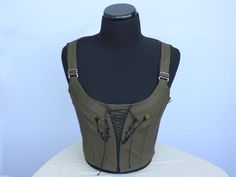 Gothic Fitted Vest Corset, Fitted Steampunk Vest For Costume Party, Fitted Cotton Corset For Costume, Fitted Gothic Green Corset, Fitted Gothic Vest For Cosplay, Fitted Cotton Vest With Tank Straps, Fitted Military Tops For Spring, Spring Military Style Fitted Tops, Gothic Cotton Vest For Alternative Fashion