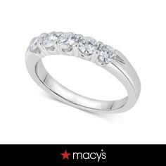 a white gold ring with five stones on the side and an inscription that says macy's