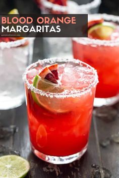 three glasses filled with red drinks and garnished with limes