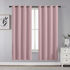 the pink curtains in this room are ready to be hung on the window sill