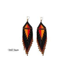 Red black earrings Unusual earrings Statement earrings Geometric earrings Fire earrings Red yellow earrings African earrings Ankara earrings Long dangle earrings Beaded earrings Hippie earrings Fringe earrings Seed bead earrings These elegant and fieric earrings made of high-quality Czech beads. They have a metal hook with gold plating. These earrings are not authentic African earrings, but are made according to my author's design. Colors: Black + Red + Yellow + Gold Length of the Earrings - 5.5 Orange Dangle Jewelry With Colorful Beads, Handmade Black Jewelry For Festivals, Orange Teardrop Jewelry With Colorful Beads, Red Handmade Earrings For Festivals, Handmade Red Earrings For Festivals, Handmade Red Dangle Plug Earrings, Orange Beaded Dangle Jewelry, Handmade Red Long Drop Jewelry, Red Round Bead Earrings For Festivals