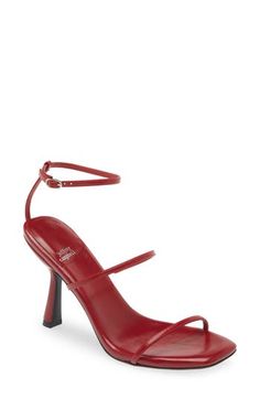 Slender straps and a minimalist silhouette create modern intrigue on a striking sandal framed by a square toe and tapered heel. 4" heel Adjustable ankle strap with buckle closure Leather upper/leather and synthetic lining/synthetic sole Imported Dark Red Strappy Heels, Modern Red Sandals With Heel Loop, Rust Heels, Fitted Red Strappy Sandals, Red Sandals With 4-inch Block Heel, Red Strappy Heels, Red Sandals Heels, Red Strappy Sandals With 4-inch Heel, Minimalist Silhouette