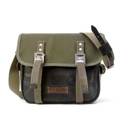 Olive Canvas Leather Messenger Bag, Crossbody Bag, Classic Messenger is made from a recycled leather jacket and a German military seabag. This is an all original upcycled, recycled messenger bag, Messenger Bag, emulates a model of an US-army bag from 1943. Inside there are 2 useful slip-pockets with Retro Green Leather Satchel, Green Coated Canvas Shoulder Satchel, Functional Green Leather Shoulder Bag, Green Leather Shoulder Bag With Leather Trim, Functional Leather Shoulder Bag With Waxed Finish, Upcycled Satchel Bag For Everyday Use, Daily Use Upcycled Satchel Shoulder Bag, Green Upcycled Shoulder Bag For Everyday, Everyday Use Upcycled Satchel Bag