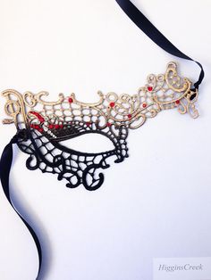 Masquerade Ball Masks Custom made and embellished to match your formal masquerade Party dress or costume. Intricately designed in the half face shape. All Masks come with either matching Ribbons or Stretched Lace. Base Material - Embroidered Lace Mask. All Masks come with either matching Ribbons or Stretched Lace. You may leave a note during checkout if you have a preference. Mask is available in left eye or right eye covered mask. You can leave a note during check out if you have a preference. Elegant Mask For Carnival, Elegant Carnival Mask Costume Accessory, Handmade Halloween Masquerade Mask For Party, Black Masks For Halloween Gift, Handmade Gothic Masks For Halloween Party, Black Halloween Masks As Gifts, Halloween Eye Mask As A Gift, Handmade Masks For Halloween Party, Fantasy Halloween Masks For Gift