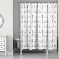 a bathroom with a shower curtain and mirror