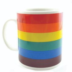 a multicolored coffee mug is shown on a white background with the colors of the rainbow